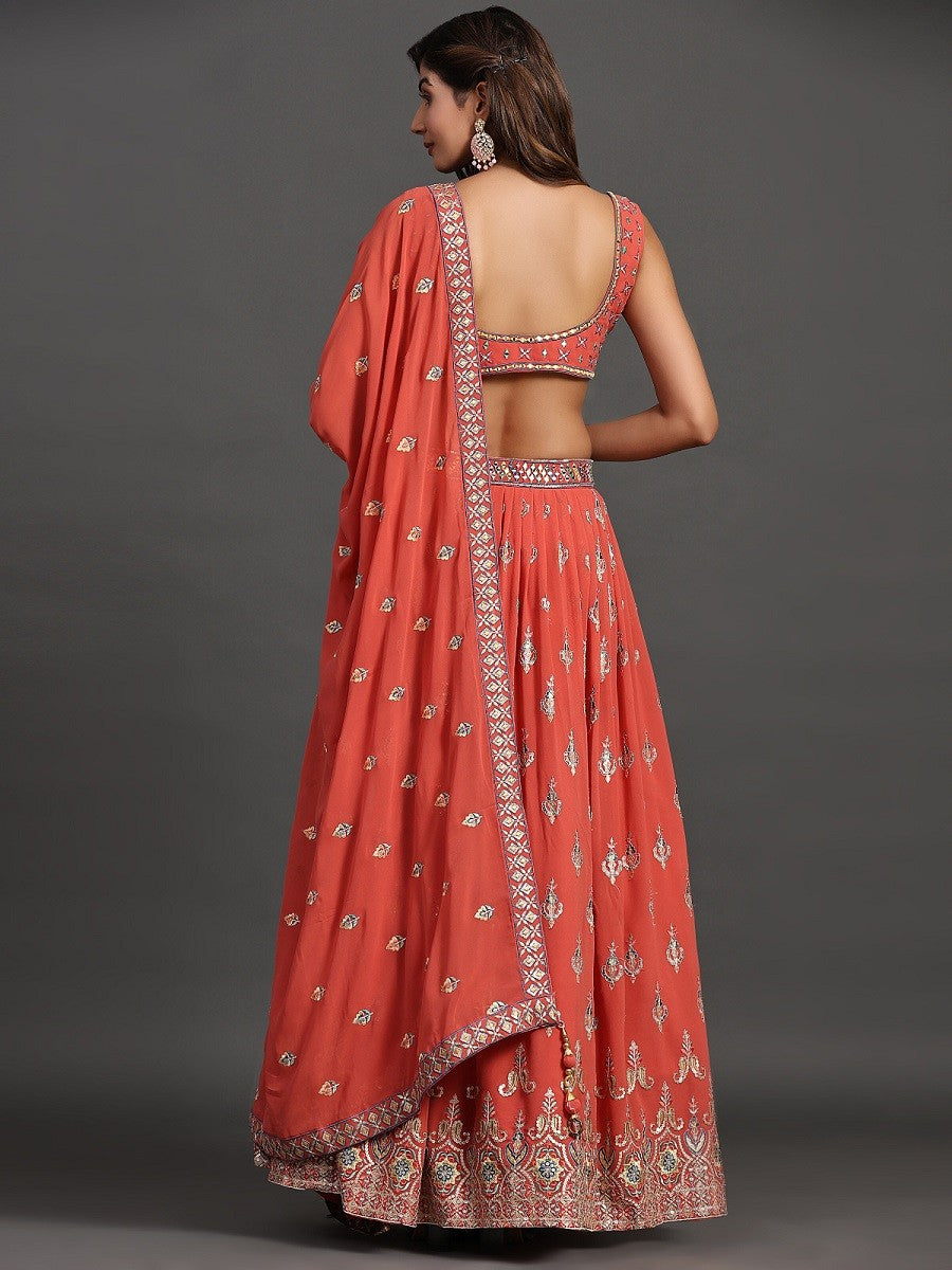 Model posing in Elegant Coral Georgette Party Look Lehenga Choli, demonstrating the stylish and graceful fit.