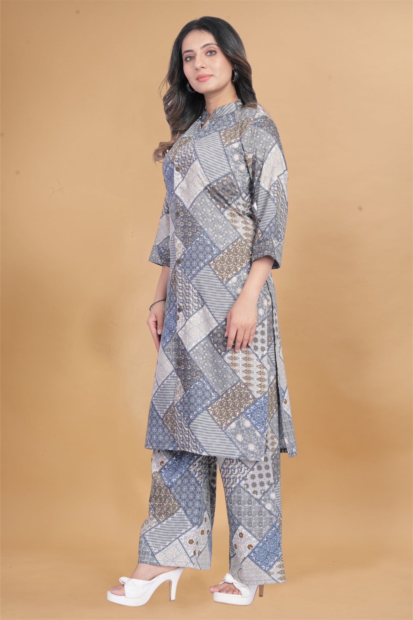 Model posing in Stylish Grey Muslin Printed Women's Kurti and Palazzo Set, demonstrating the stylish and comfortable fit.