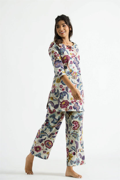 Model posing in Chic Multi Colour Cotton Rayon Women's Wear Co-ords Set, demonstrating the stylish and comfortable fit.