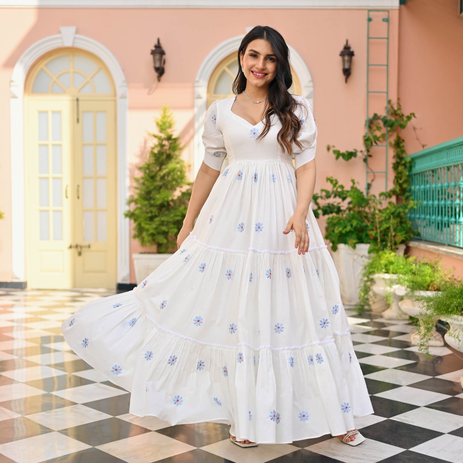 Model posing in Floral Print Embroidered Flaired Gown with Round Flair, demonstrating the flattering fit.