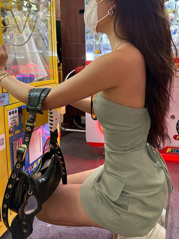 Woman wearing Elegant Lace-Up Hollow Strapless Short Dress, showcasing the lace-up front and strapless design.