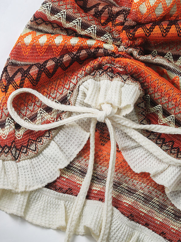 Close-up of the color stripes and pleated skirt on the Square Neck Suspender Dress, highlighting the knitted texture.